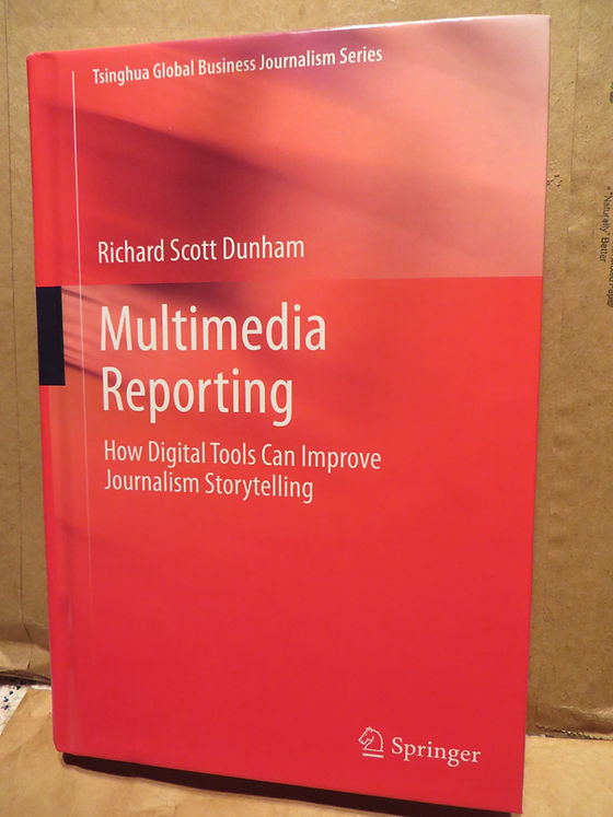 Book cover titled 'Multimedia Reporting' by Richard Scott Dunham, discussing how digital tools can enhance journalism storytelling, with a red background.